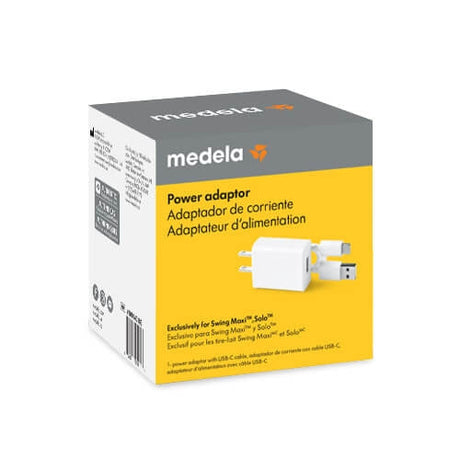Packaging product shot of the Medela Replacement Power Adaptor for the Swing Maxi™ Breast Pump