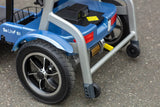 Rear wheels and anti-tipper wheels of the Blue Journey So Lite Foldable Power Scooter.