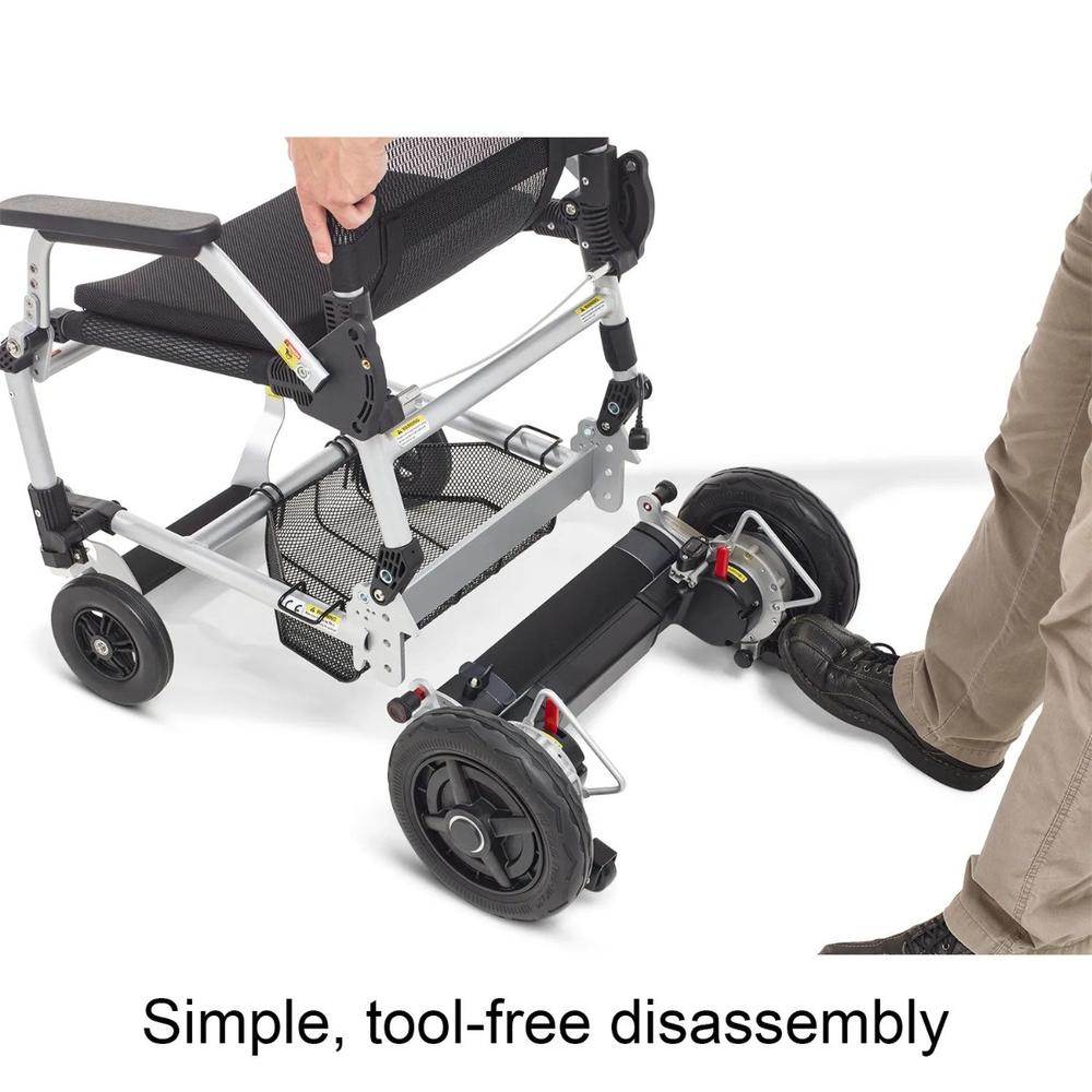 A person assembling the Journey Zoomer® Folding Power Chair by inserting the chair into the wheel motor unit.